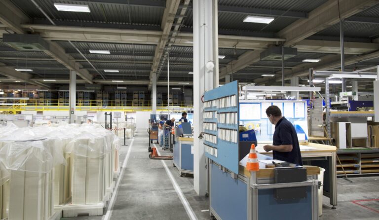 Workers in paper packaging factory Workers in paper packaging factory